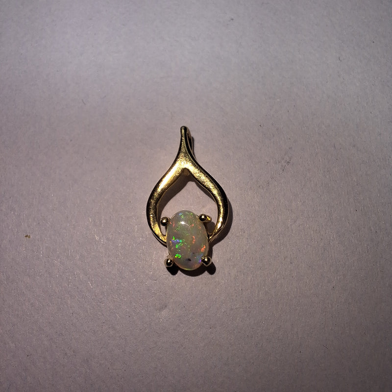 Beautiful Opal held in a 9ct Yellow Gold pendant