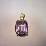 Large Amethyst held in a 9ct yellow gold pendant