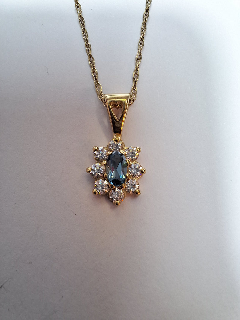 Stunning Blue topaz & cubic zirconia 9ct Gold Pendant on a suitable 9ct Yellow Gold Rope chain
