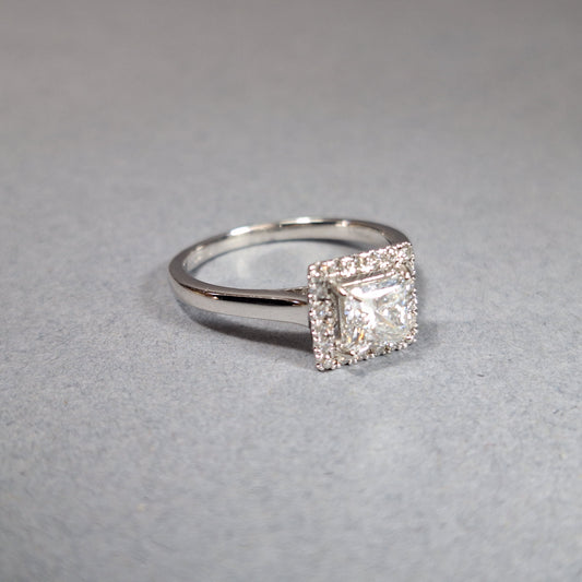 New Princess Cut 0.72ct Lab Grown Diamond with twenty round brilliant Cut Lab Grown Diamonds around the edge all on a Platinum Band