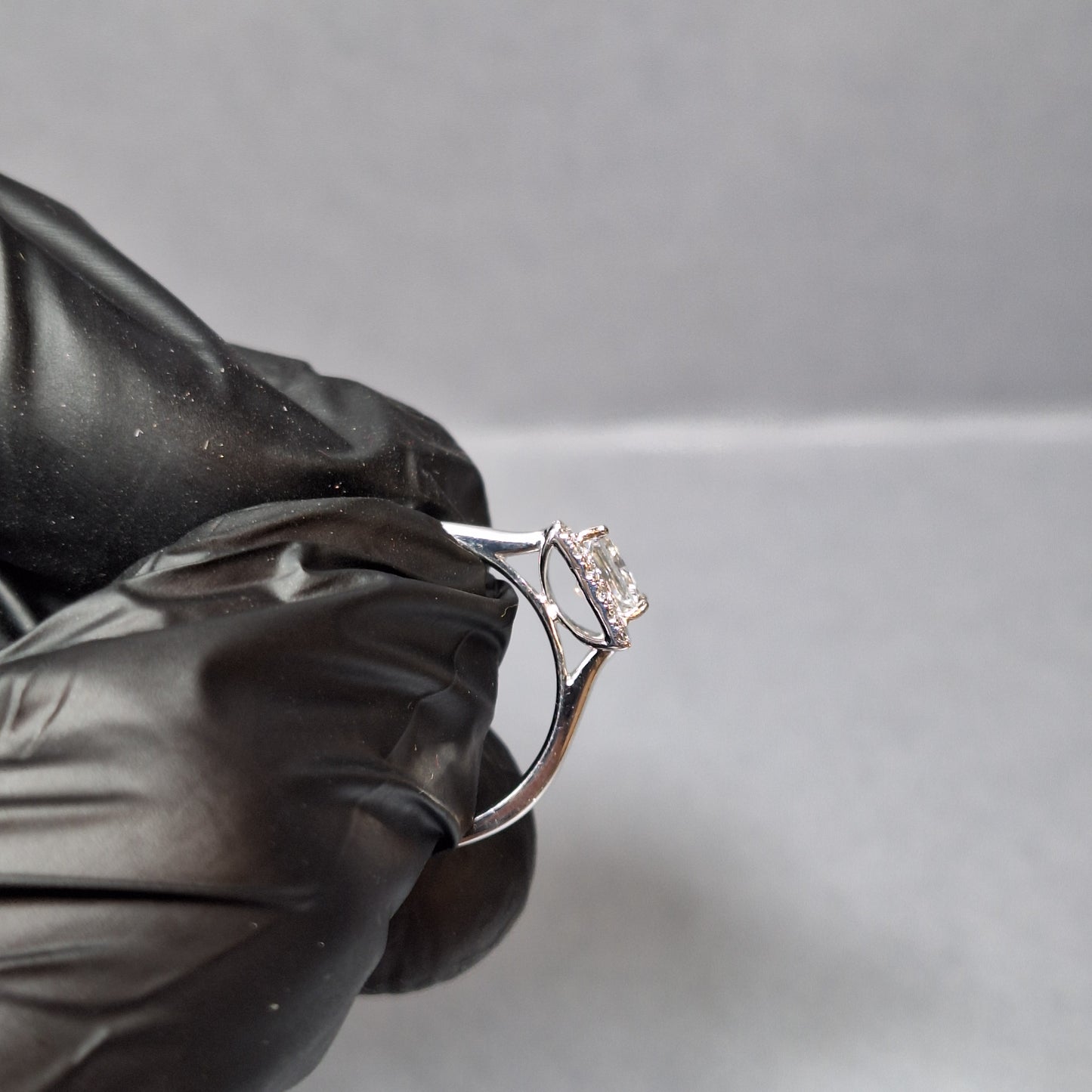 New Princess Cut 0.72ct Lab Grown Diamond with twenty round brilliant Cut Lab Grown Diamonds around the edge all on a Platinum Band