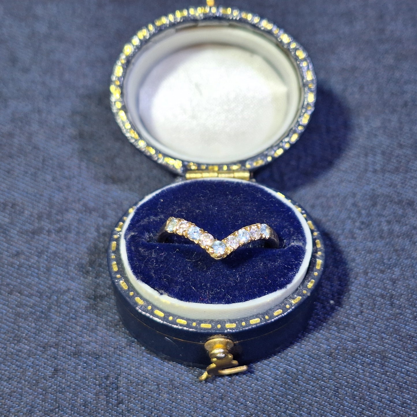 18ct half wish bone with cubic zirconia & blue topaz