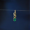 Vintage 9ct yellow gold pendant decorated with an Emerald style stone