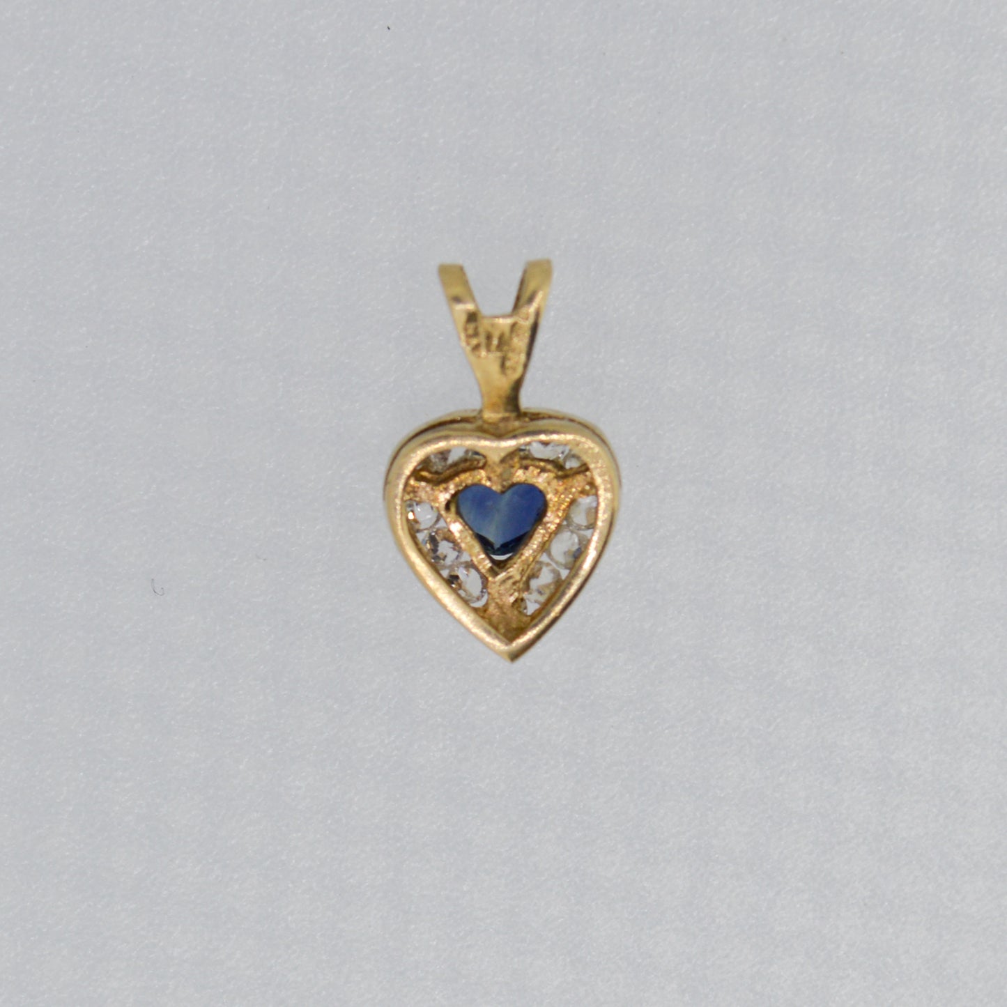 9ct Yellow Gold Sapphire style pendant surrounded with cubic zirconia