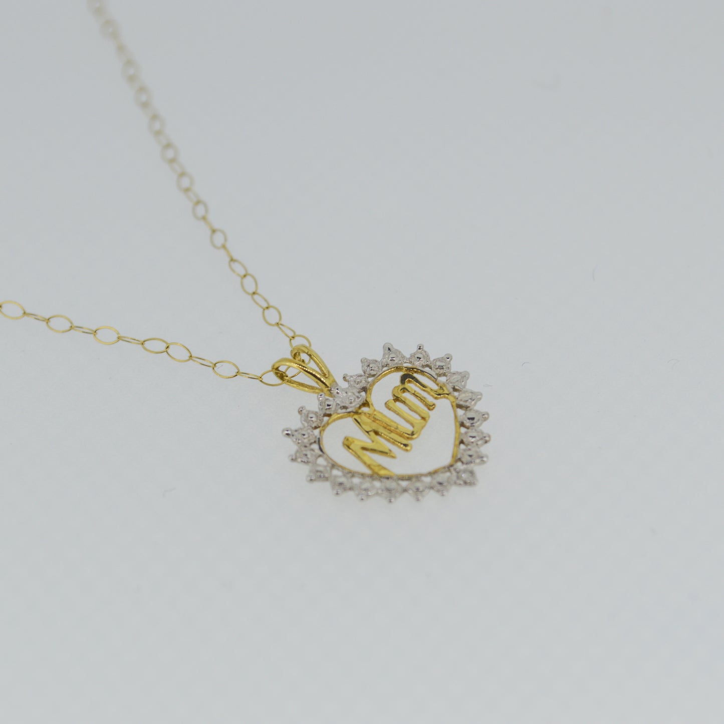 9ct Yellow gold 'Mum' pendant with White Gold detailing, on a trace chain