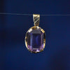Large Amethyst held in a 9ct yellow gold pendant