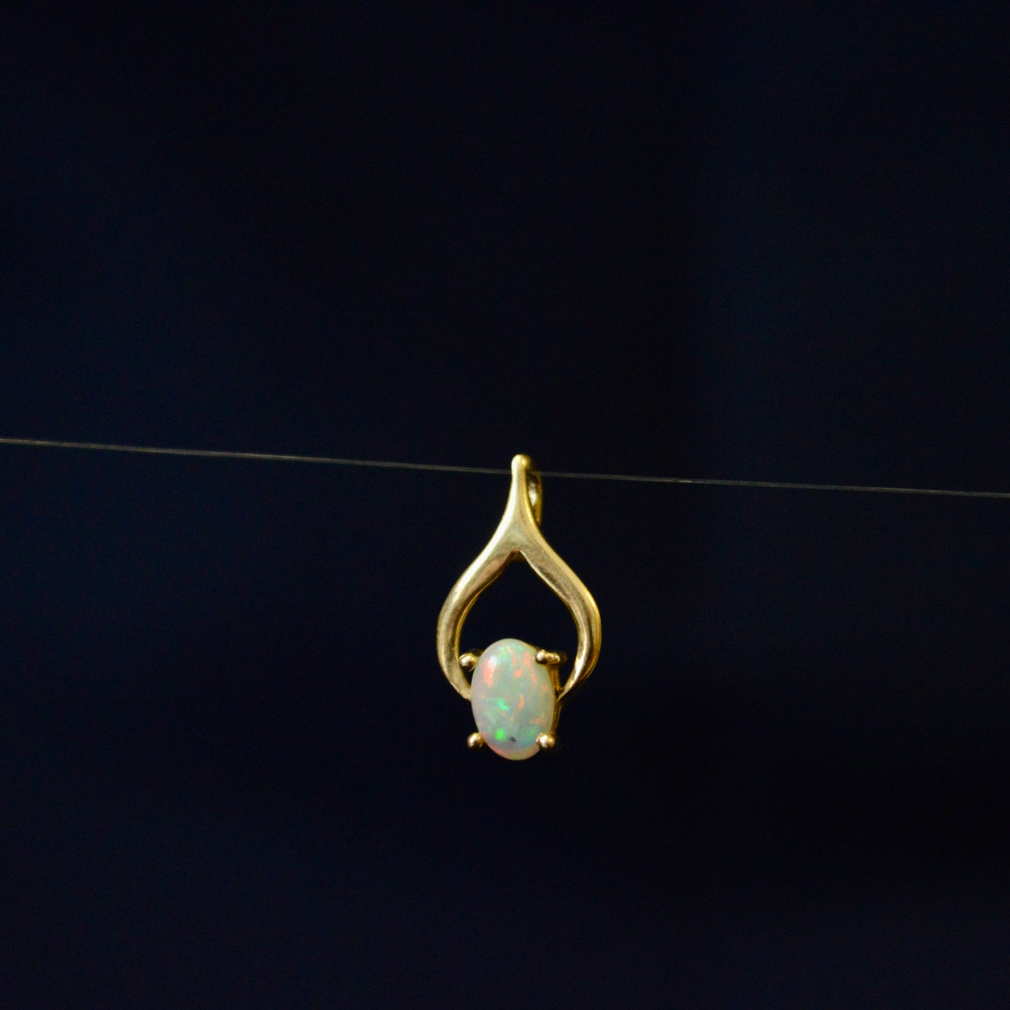 Beautiful Opal held in a 9ct Yellow Gold pendant
