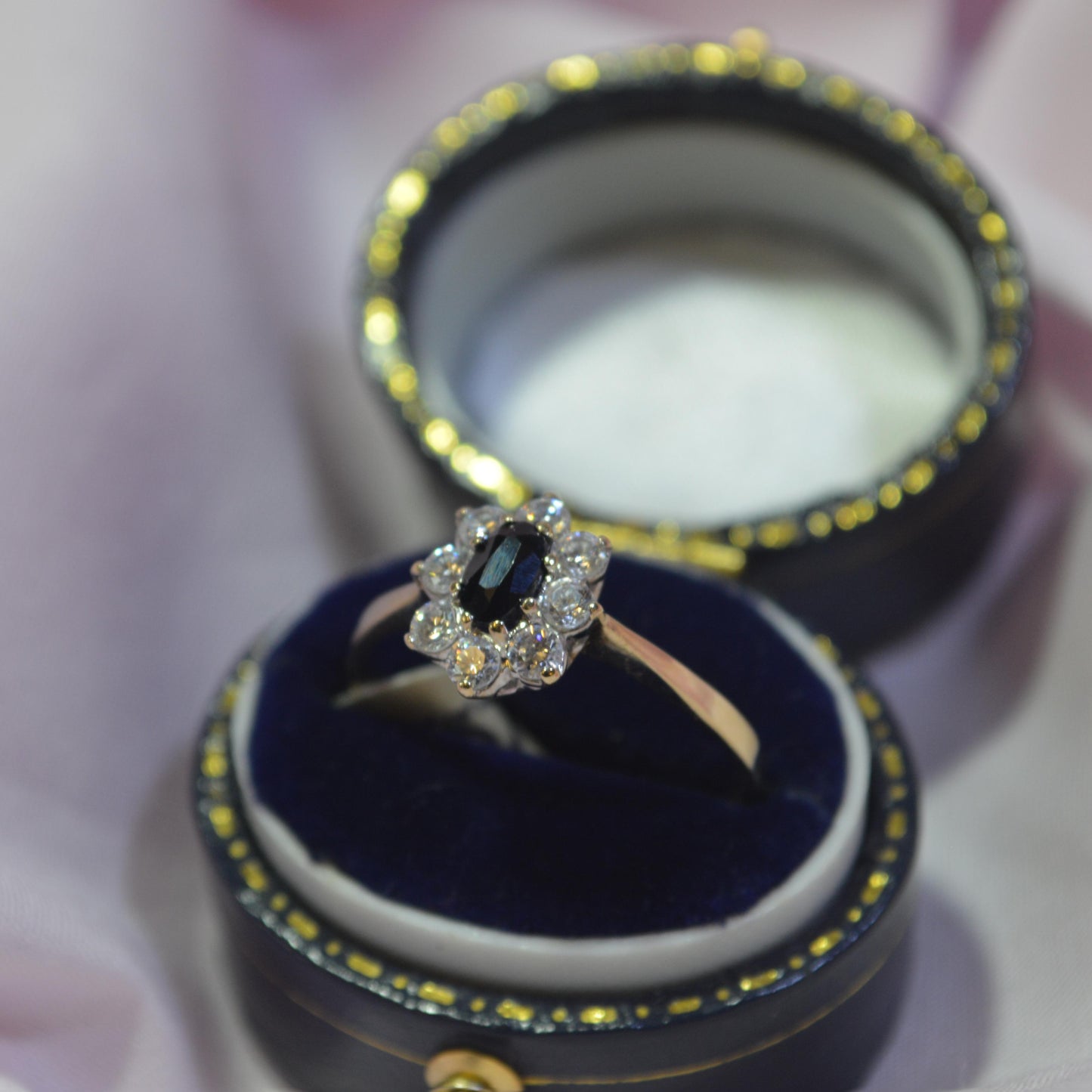 9ct Sapphire surrounded by cubic zirconias