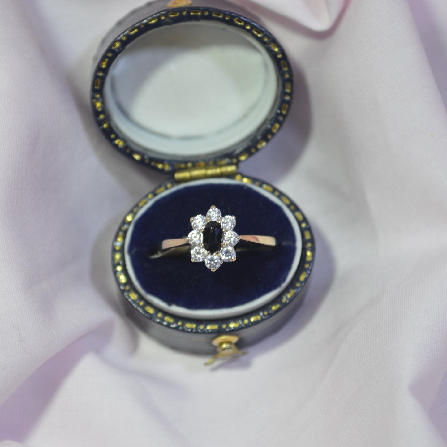 9ct Sapphire surrounded by cubic zirconias