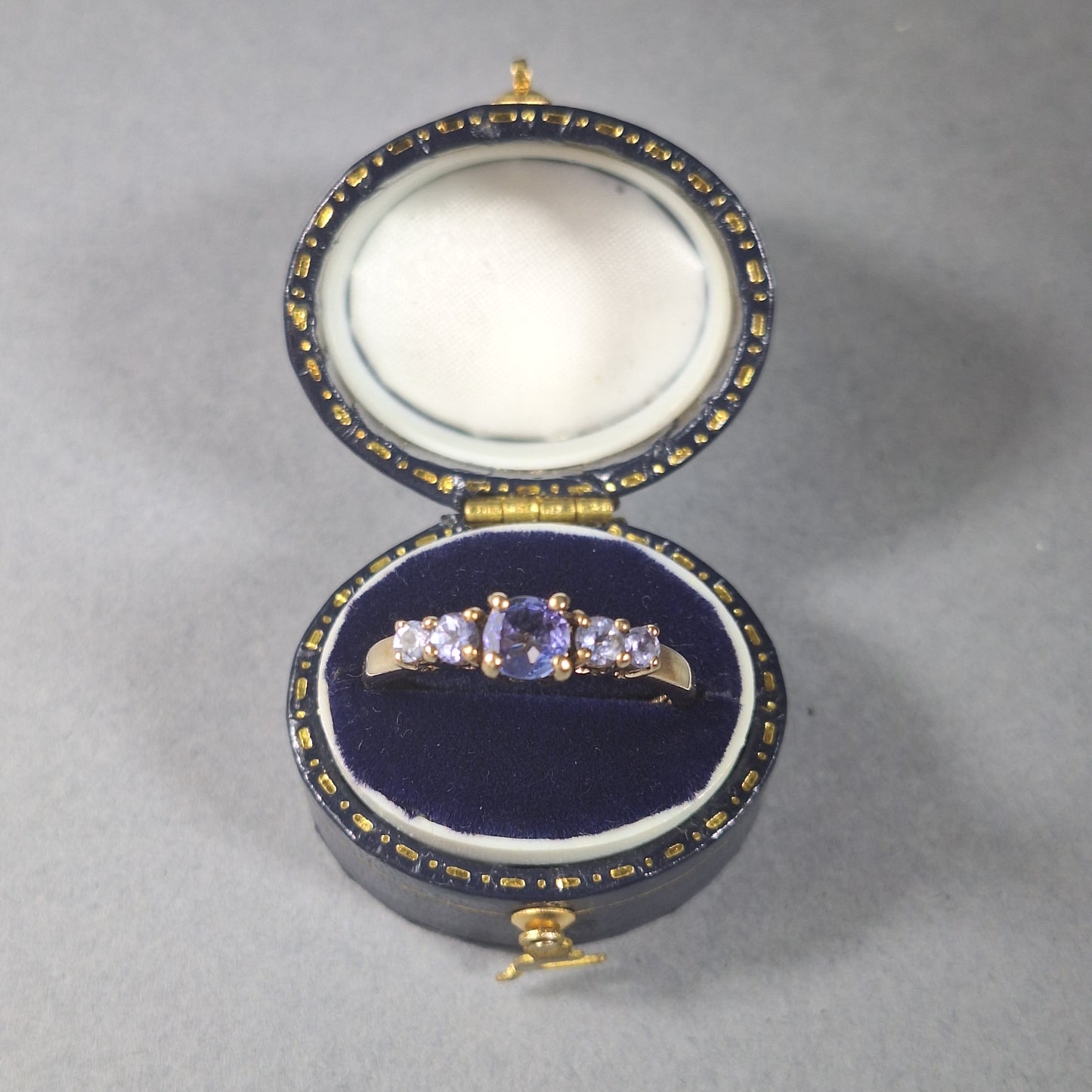 Five stoned Tanzanite 9ct Yellow gold ring